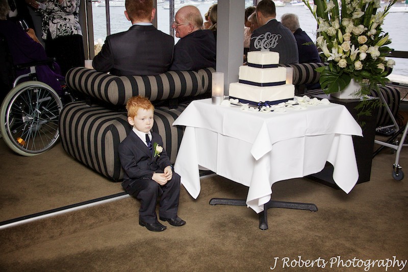 Paige boy sitting next to wedding cake at Sails Lavender Bay - wedding photography sydney